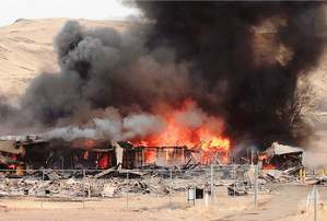 The Mustang Ranch II brothel building goes up in flames Sunday after it was set on fire by Storey County fire officials for training purposes for firefighters. The Mustang Ranch II brothel building goes up in flames Sunday after it was set on fire by Storey County fire officials for training purposes for firefighters.